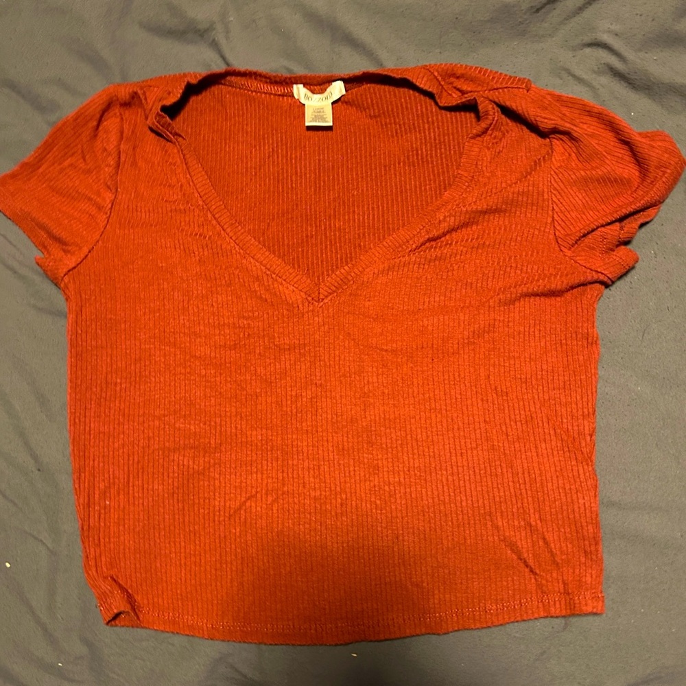 Size large cropped tight fit shirt.